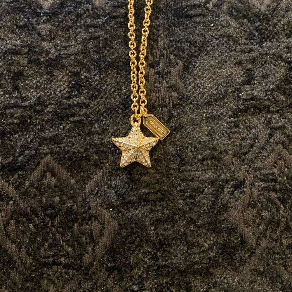 Coach Gold tone crystal pave pyramid star necklace